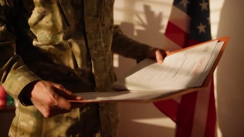 Soldier Reads Confidential Documents in Military Office