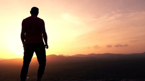 Happy Man Raising Arms with Victory on Hill During Sunset, Super Slow