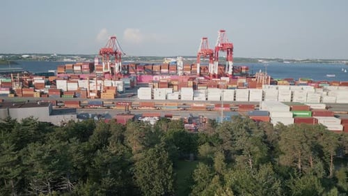 Aerial View of a Container Yard with a Container Ship Unloading