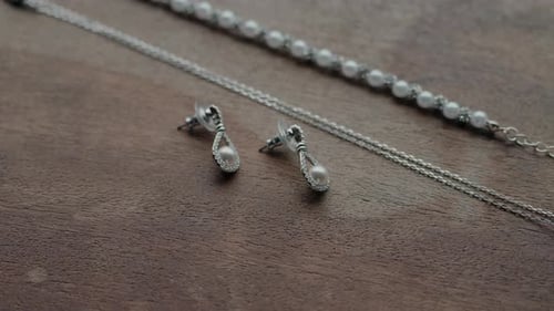 Elegant Pearl Jewelry Set on Wooden Surface