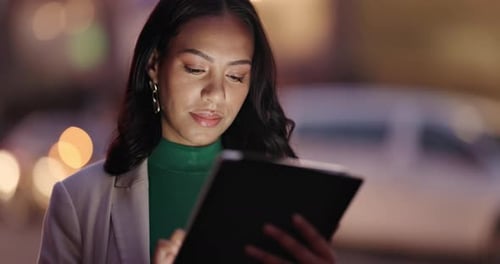 Young Adult Woman Using Tablet at Night