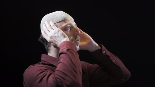 Man Wearing Kufi in Prayerful State