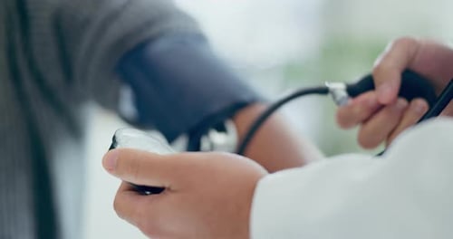 Close Up of Doctor Checking Blood Pressure