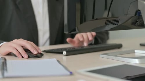 Close Up of Young Businesswoman Working on Computer, Typing