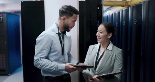 Happy Colleagues Celebrate Success in Server Room