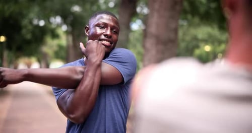 Nature, fitness and black man stretching arms for exercise in outdoor park, field or garden