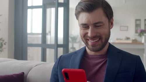 Closeup Handsome Business Man Laughing With Phone At Home. Portrait Of Smiling Guy Reading Funny ...