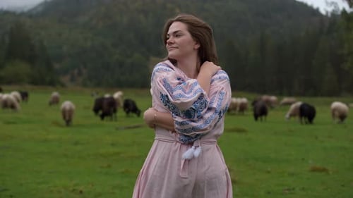 Young Woman Embracing Nature in a Mountain Meadow