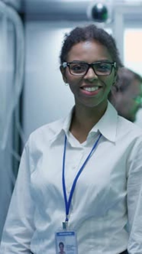 Female Manager Smiling in Data Center