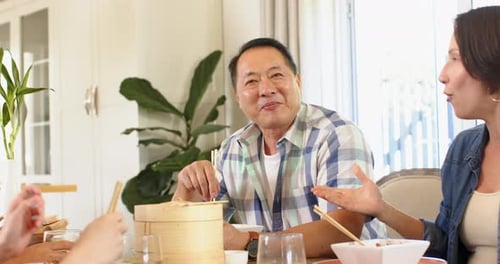 Family Enjoys Meal and Hugs at Home