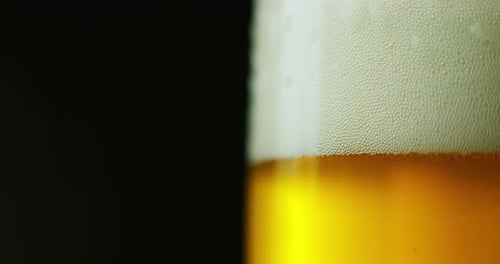 Close Up of Glass of Foamy Beer