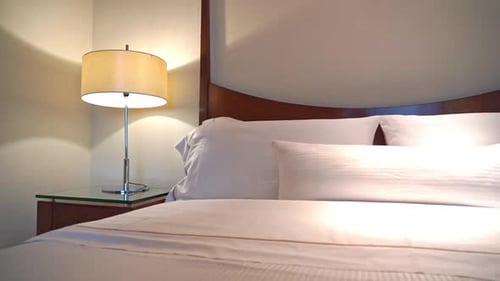 Cozy Bed With Soft Lighting in Hotel Room