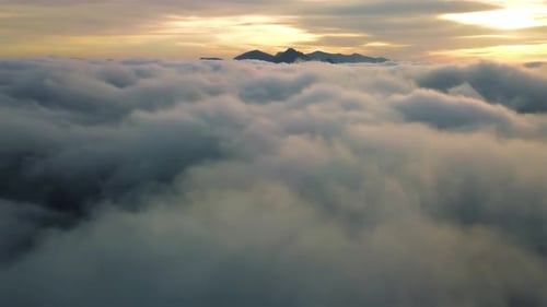 Fly Above Misty Clouds Heaven in Mountains Nature at Golden Sunrise Aerial View Background