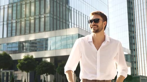 Confident Man Walking in the City on a Sunny Day