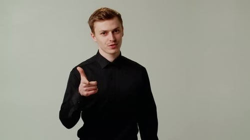 Happy Young Man in Black Shirt Point Finger Front to the Camera Good Job you are Cool Businessman
