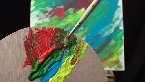 Bright Paints Mixing on Palette for Artistic Painting