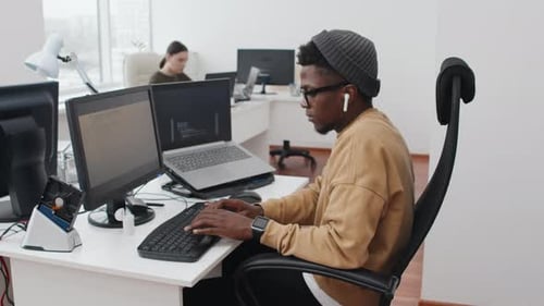 Young Black Man Working On Code
