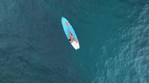 Aerial View Exploring the Clear Waters of a Mediterranean Lagoon on Paddleboards