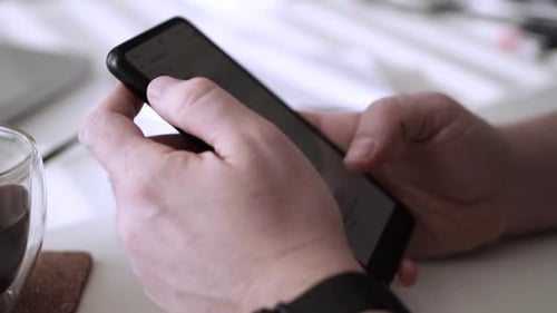 Man scrolling social media in smartphone