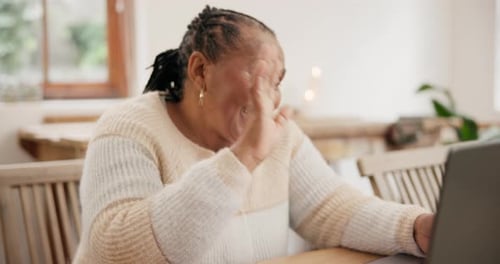 Smiling Woman Waving During a Video Call