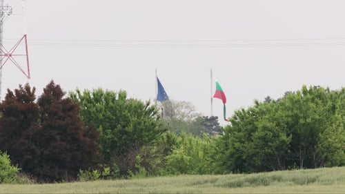 Bulgarian and European Union Flags Waving in Field