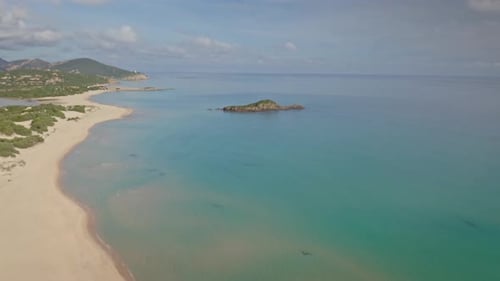 Aerial view of Spiaggia Su Giudeu and clear water, Italy.