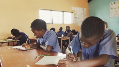 Close View of Pupils in Classroom of African Children Writing English