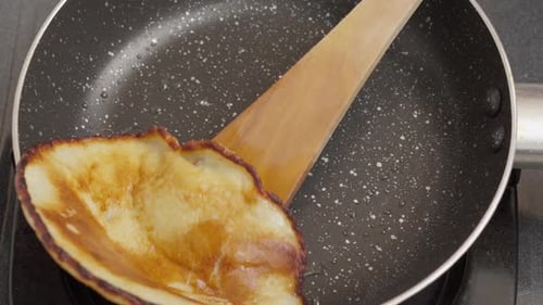 Pancake Being Flipped in a Pan
