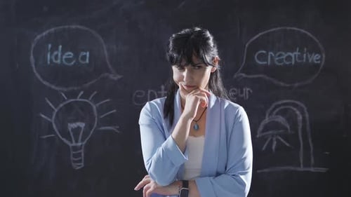 Woman With Idea Near Blackboard Drawings