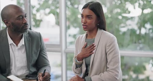 Three Adults Collaborating in Bright Office Setting