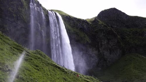 Gorgeous wide shot of Seljalandsfoss, a powerful waterfall in Iceland.
