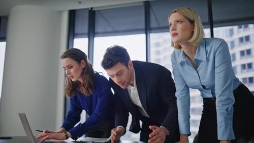 Office Coworkers Looking Solutions Collaborating on Project in Workplace Closeup