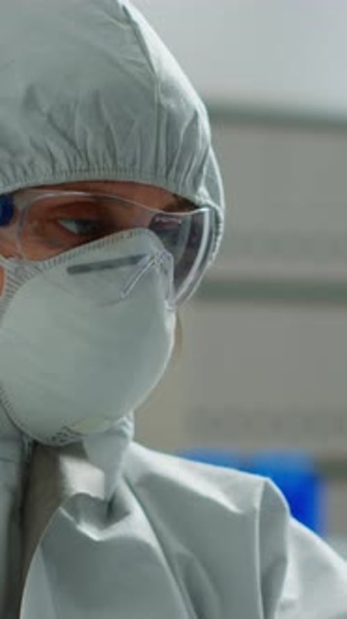 Healthcare Worker in Protective Suit with Safety Gear