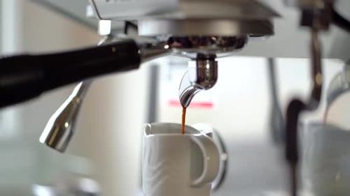 Espresso Machine Brewing Fresh Coffee into Mug