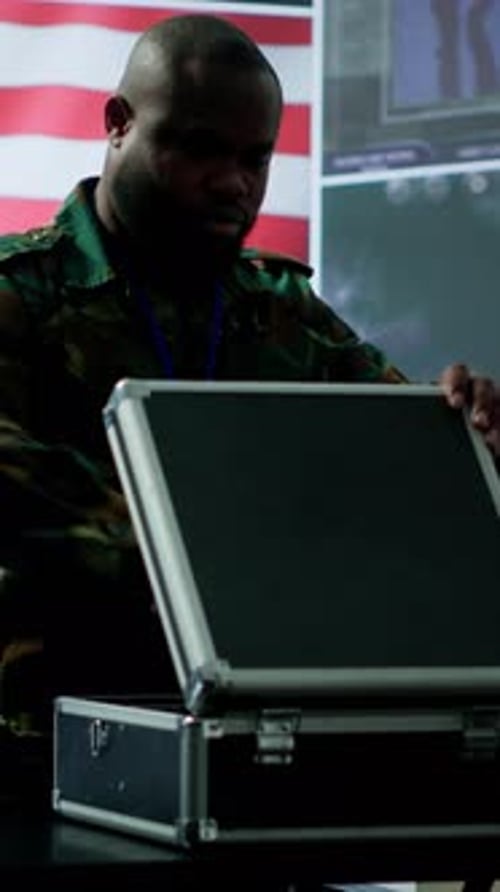 Vertical Video US Military Personnel Work in a Modern Army Command Post
