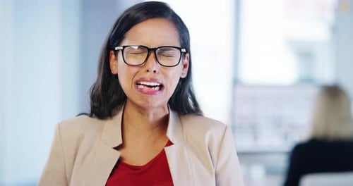 4k video footage of an attractive young businesswoman crying while standing in the office