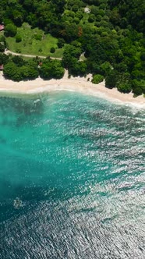 Beach and Ocean Waves on Coastline of Samal Island Davao Philippines