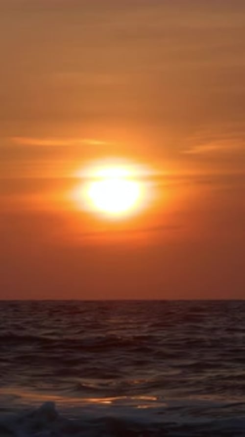 Golden Sunset Over Ocean Waves Vertical Video