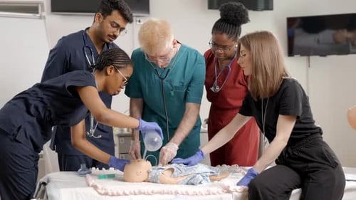 Medical Staff Practicing on Baby Manikin in Hospital