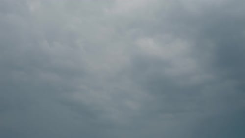 Lightning strikes illuminate dark storm clouds in dramatic weather display