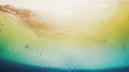 Aerial View of the Sea with Gentle Waves and Sandy Beach