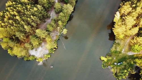 Aerial View of Small Island with Pine Trees in the Middle of the Lake