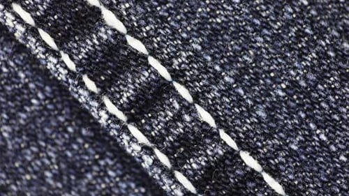 Macro Shot of Blue Denim Fabric with Seam