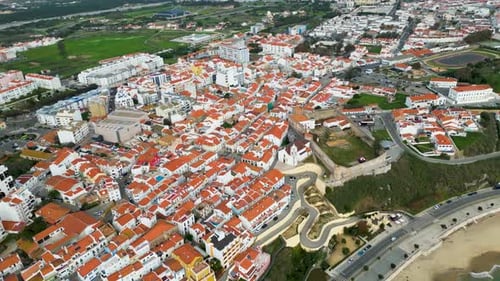 Aerial view of Sines cityscape with red rooftops, Portugal.