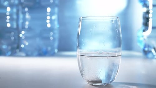 Tablet Dissolving in Glass of Water