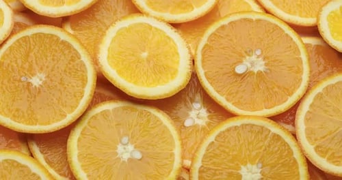 Top Down Background View Made of Fresh Sliced Organic Oranges Closeup