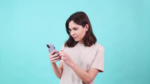 Woman Using Smartphone Reading Laughing and Expressing Various Emotions
