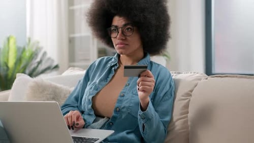 Woman Shops Online with Laptop and Card