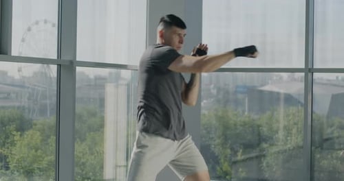 Man Practicing Punches at Urban Fitness Gym