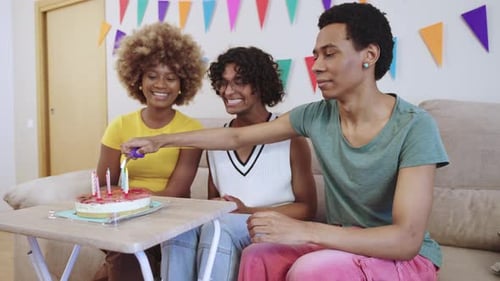 Friends Celebrating Birthday with Cake and Candles